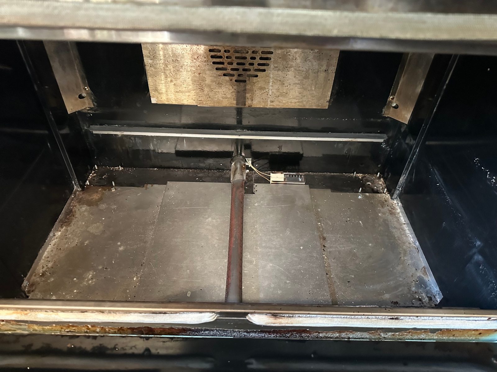 Bake burner and igniter at the base of the American Range oven
