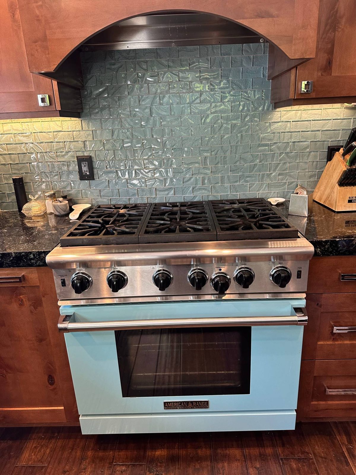 Six-burner American Range gas range with a blue oven door in a Seattle kitchen