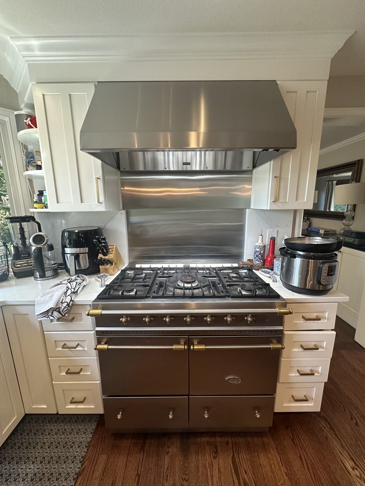 Lacanche range fully reassembled after repair in a residential kitchen