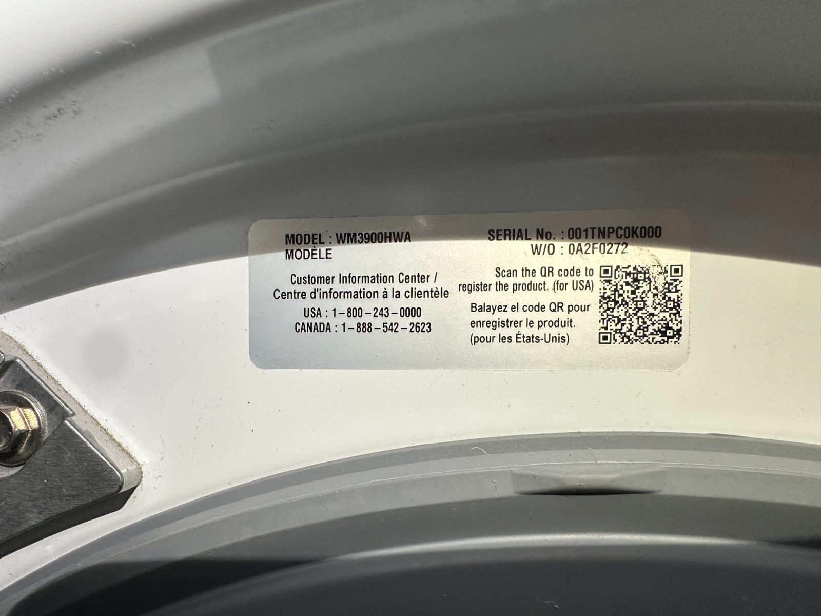LG rating label inside the washer door opening showing model WM3900HWA