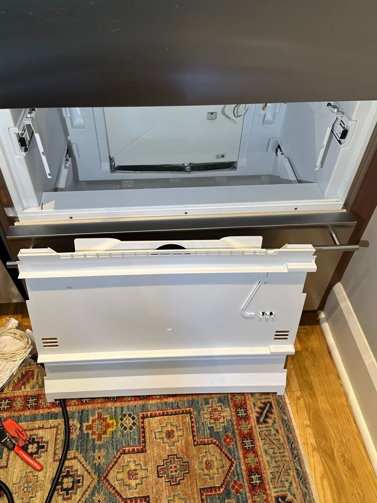 Liebherr CS 2060 with the lower freezer drawer out and the rear freezer panel removed, exposing the evaporator cover