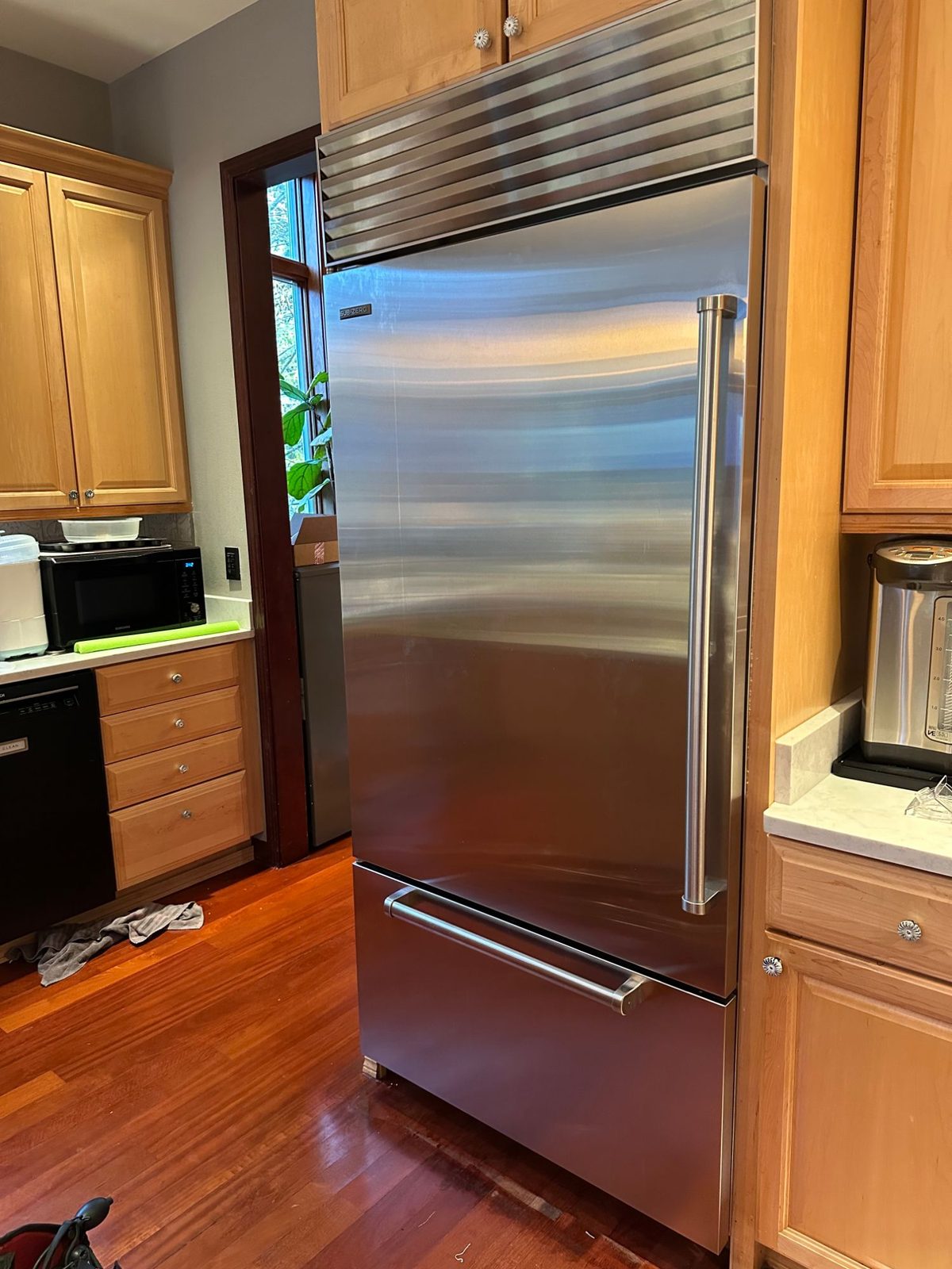 Stainless Sub-Zero BI-36UID 36-inch built-in refrigerator with a bottom freezer drawer, set into maple cabinetry in a Seattle kitchen