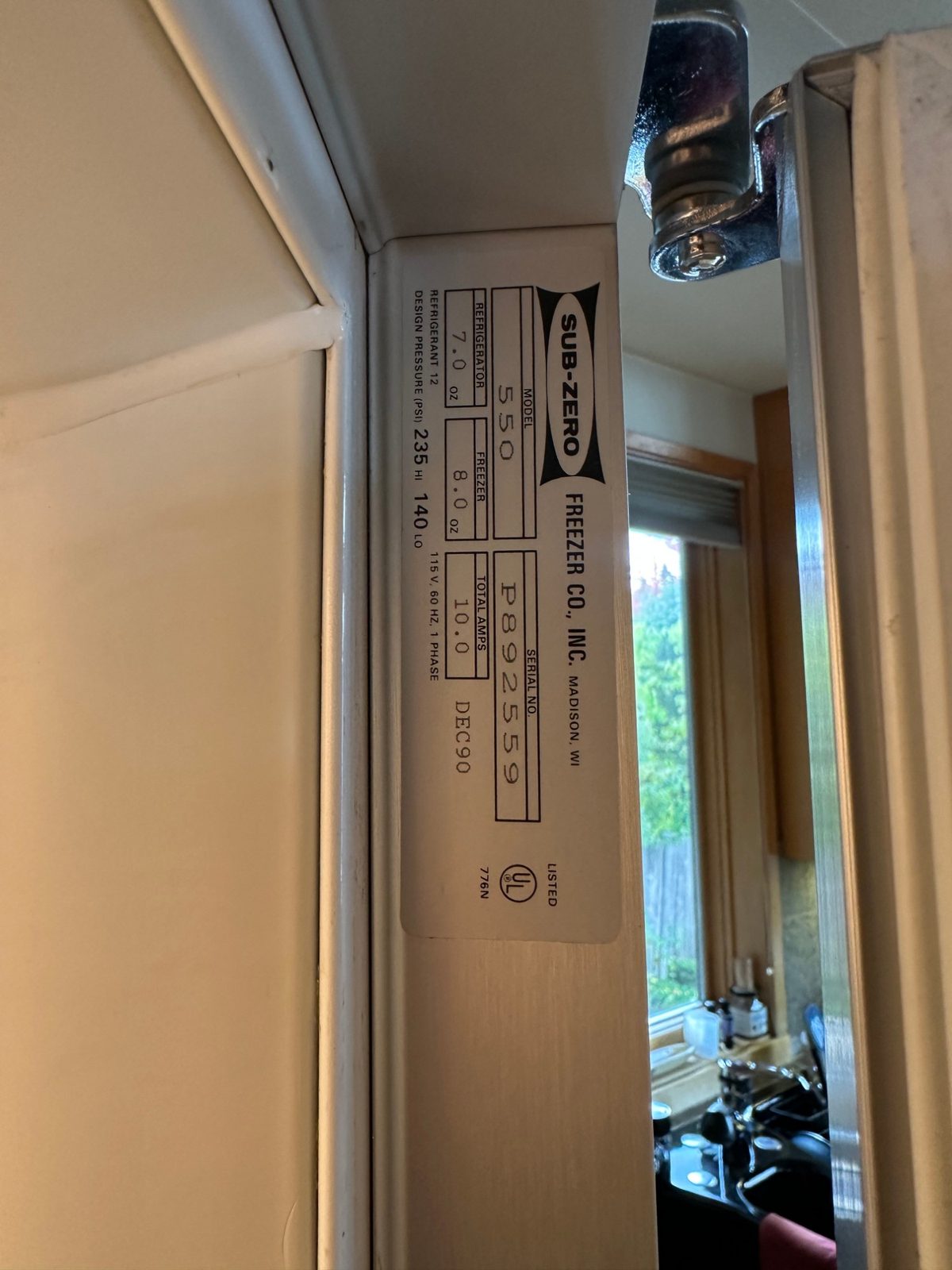 Sub-Zero Model 550 nameplate showing Refrigerant 12, separate refrigerator and freezer charges, and a December 1990 date