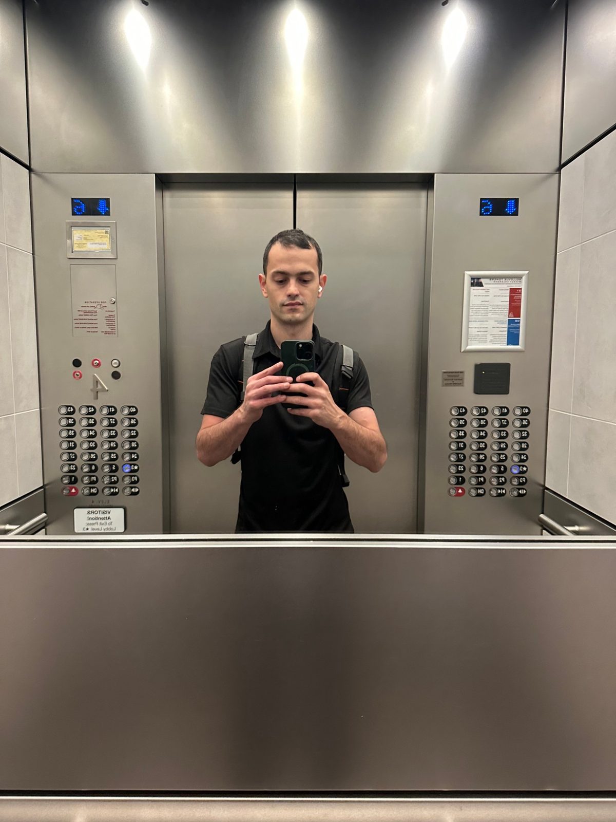 Max, owner-technician of Ace Appliance Service, in the elevator of a downtown Bellevue high-rise on the way to the Sub-Zero service call
