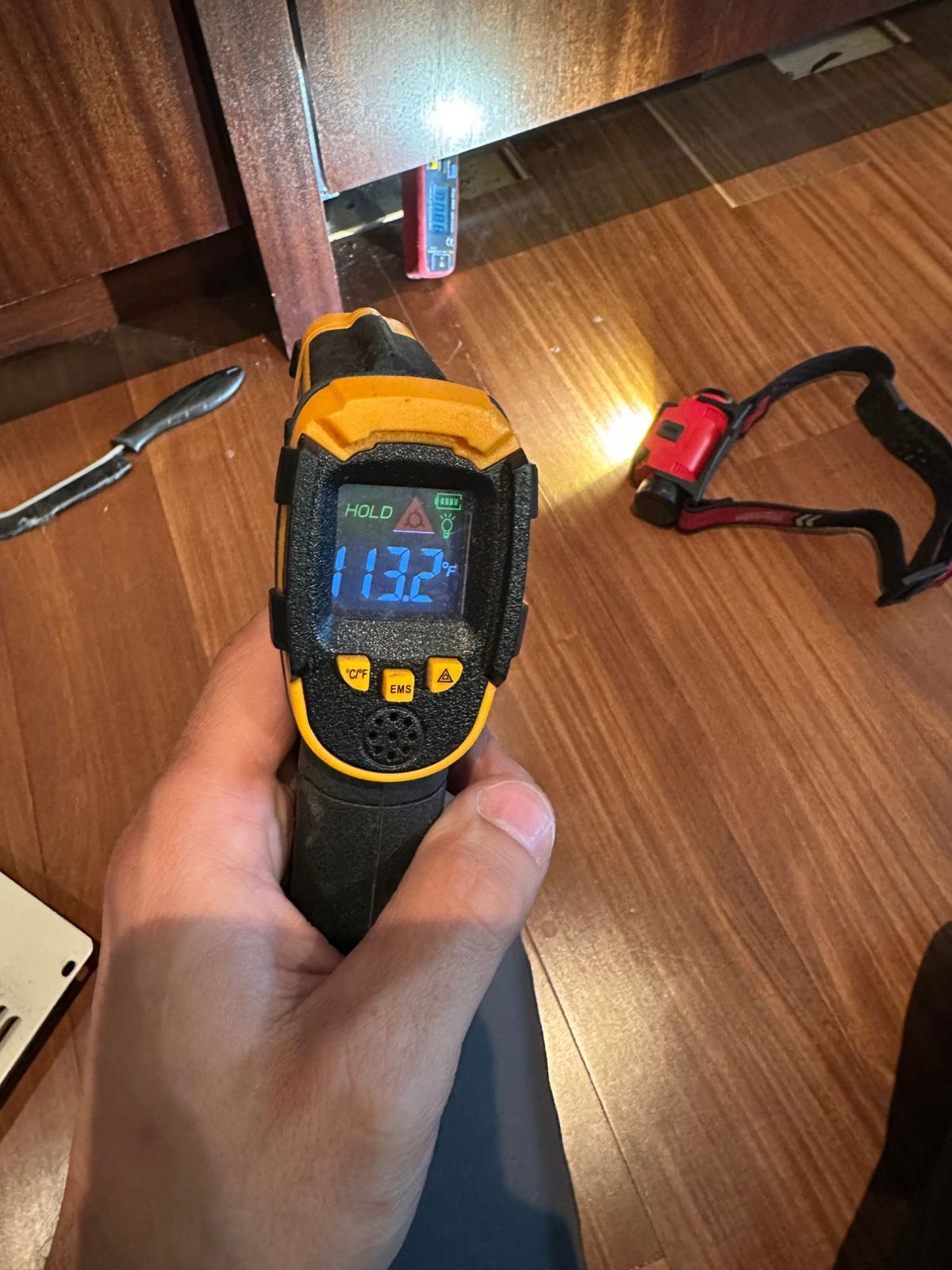 Infrared thermometer reading 113.2 degrees Fahrenheit taken at the Sub-Zero compressor