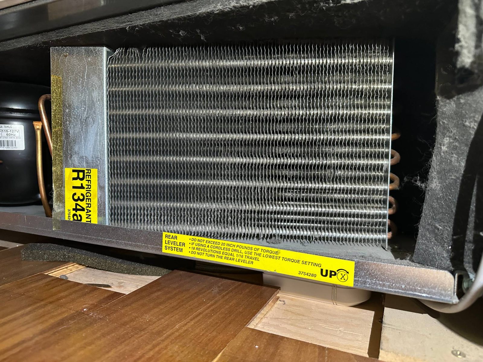 The same Sub-Zero 736TCI condenser coil after cleaning, fins clear and open for airflow