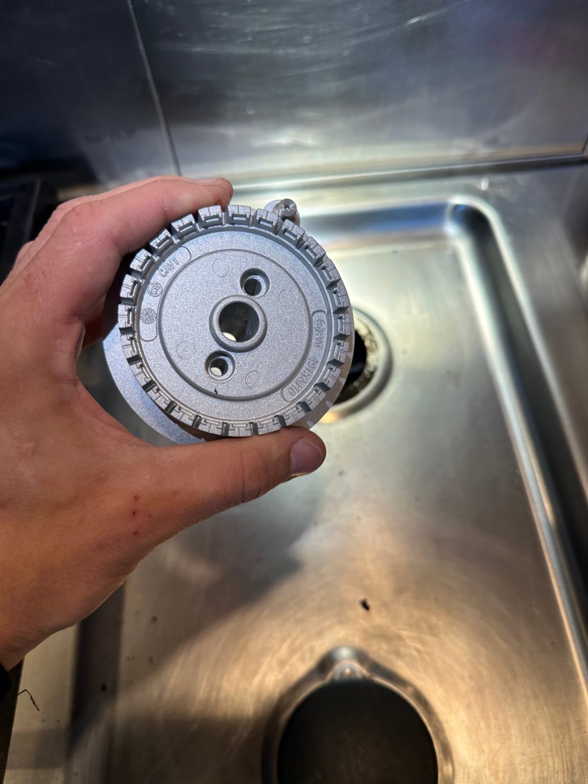 New Wolf sealed burner base, clean cast aluminum with burner ports and center opening