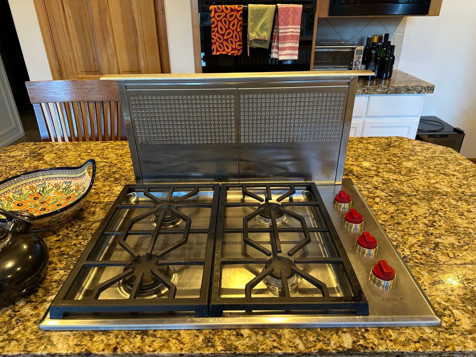 Wolf CG304P/S cooktop with the right grate removed and two new burners installed in the burner pan