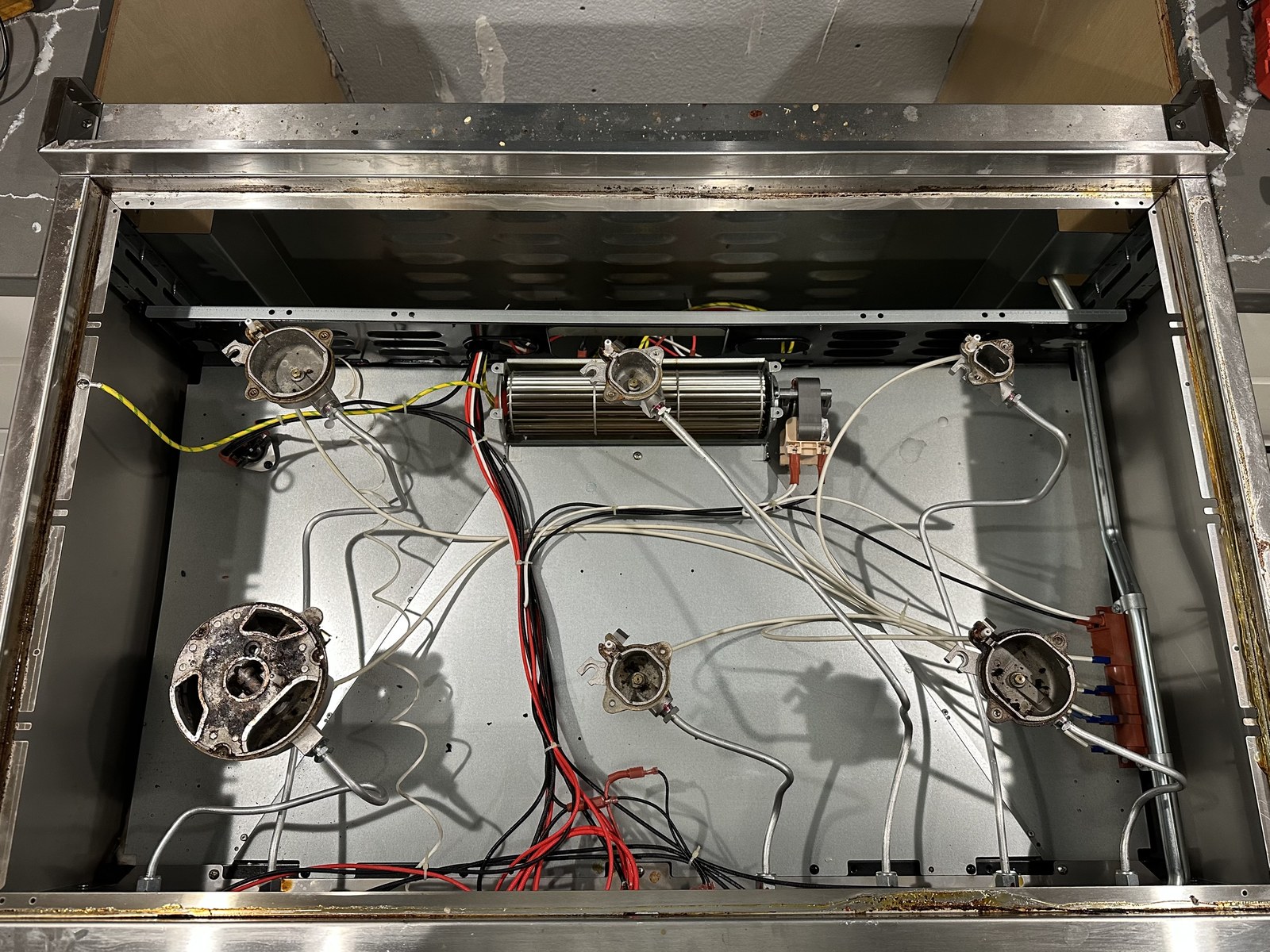 ZLINE range with igniter panel exposed during burner diagnosis