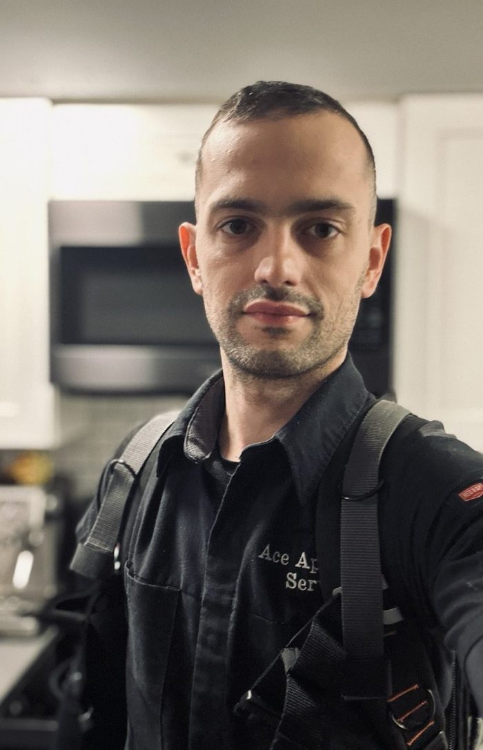 Owner-technician of Ace Appliance Service on a repair call in Everett, WA